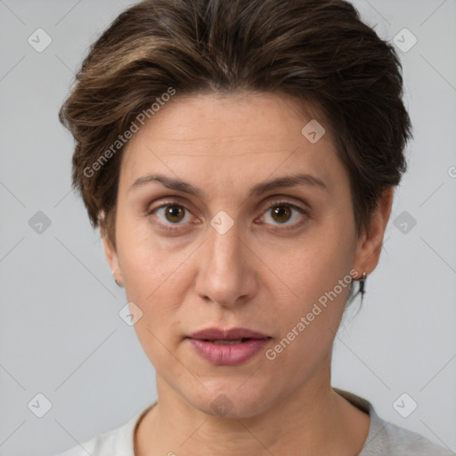 Joyful white adult female with short  brown hair and brown eyes