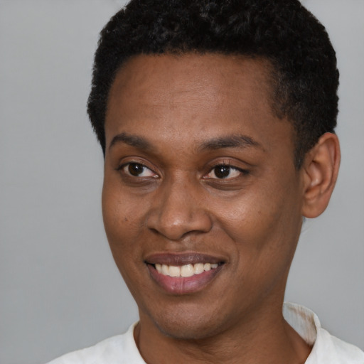 Joyful black young-adult male with short  black hair and brown eyes