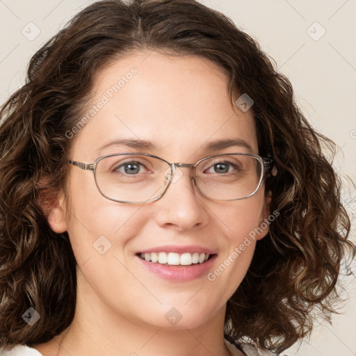 Joyful white young-adult female with long  brown hair and green eyes