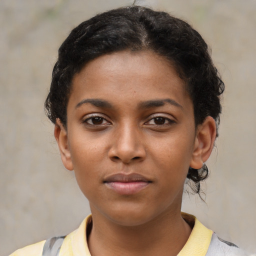 Neutral black young-adult female with short  brown hair and brown eyes
