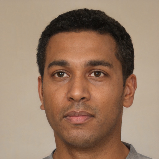 Neutral black young-adult male with short  black hair and brown eyes
