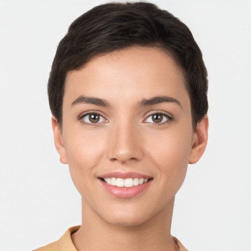 Joyful white young-adult female with short  brown hair and brown eyes