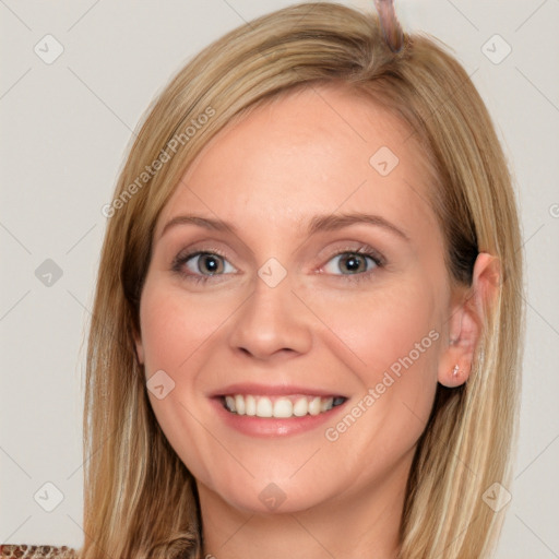 Joyful white young-adult female with long  brown hair and brown eyes