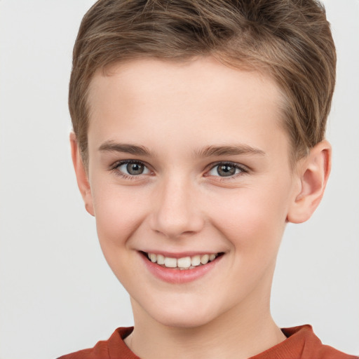 Joyful white child male with short  brown hair and brown eyes