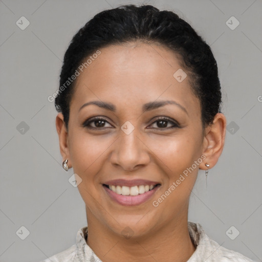 Joyful latino young-adult female with short  black hair and brown eyes