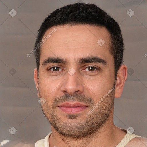 Joyful white young-adult male with short  brown hair and brown eyes