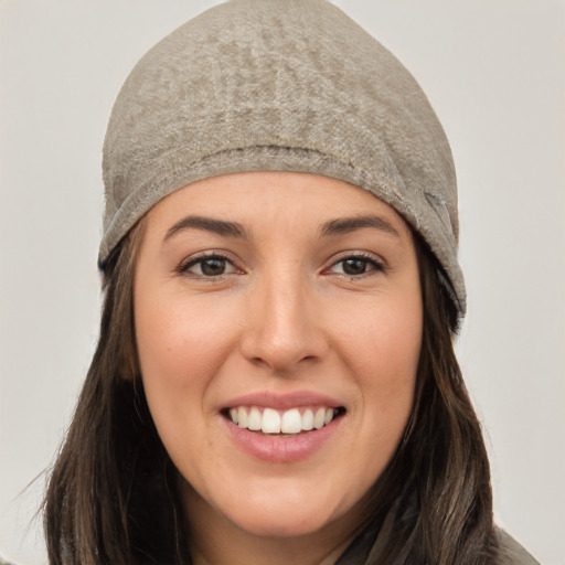 Joyful white young-adult female with long  black hair and brown eyes