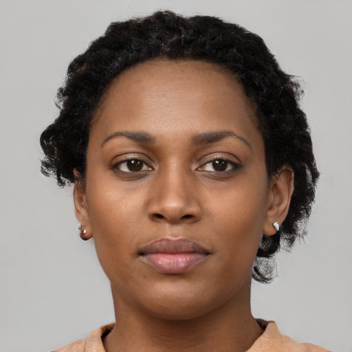 Neutral black young-adult female with short  brown hair and brown eyes