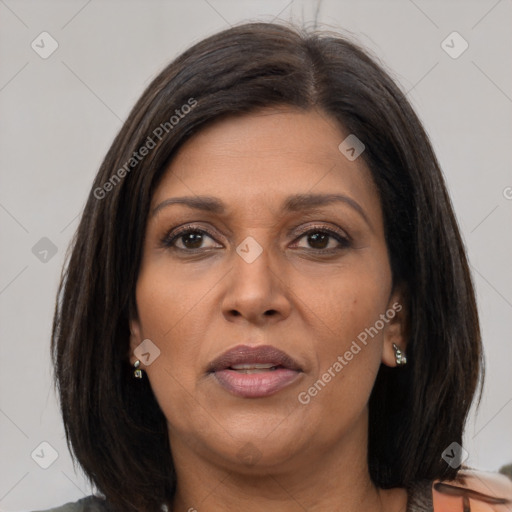 Joyful asian adult female with medium  brown hair and brown eyes