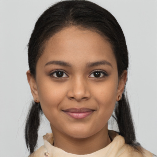 Joyful latino young-adult female with medium  brown hair and brown eyes