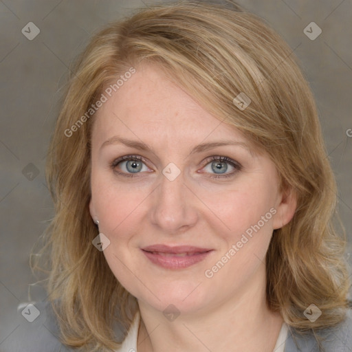 Joyful white young-adult female with medium  brown hair and blue eyes