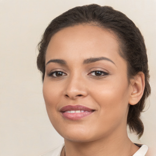 Joyful white young-adult female with medium  brown hair and brown eyes