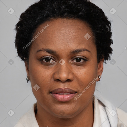 Joyful black adult female with short  brown hair and brown eyes