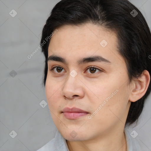 Joyful white young-adult male with medium  black hair and brown eyes