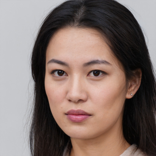 Neutral asian young-adult female with long  brown hair and brown eyes