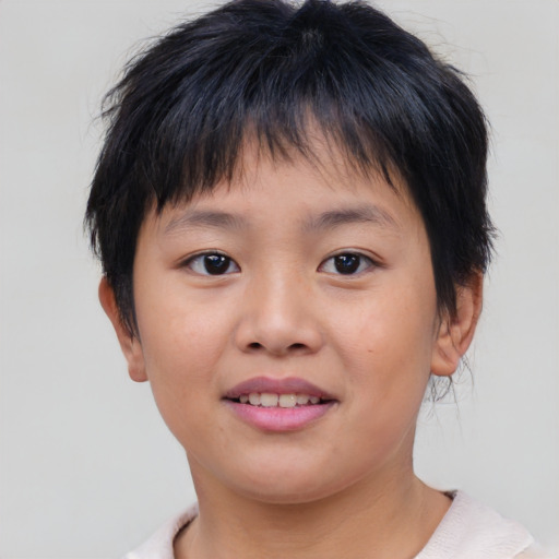 Joyful asian child female with short  brown hair and brown eyes