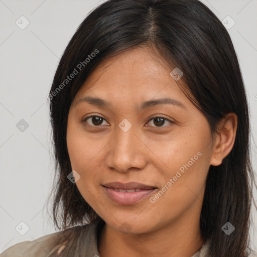 Joyful latino young-adult female with medium  brown hair and brown eyes