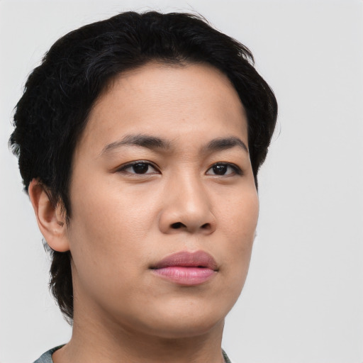Joyful asian young-adult female with short  black hair and brown eyes