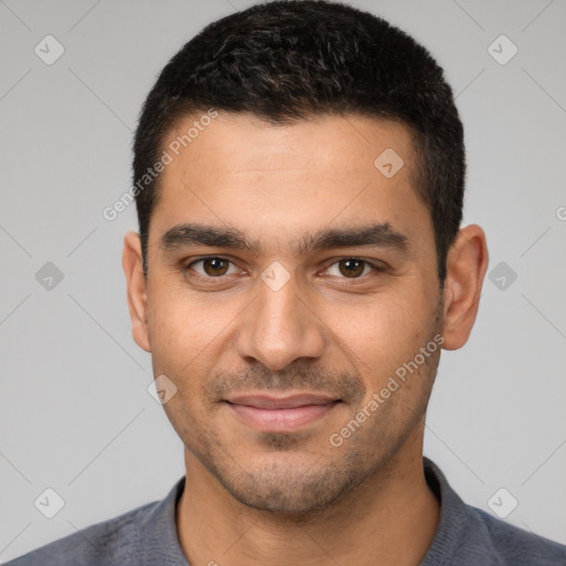 Joyful latino young-adult male with short  black hair and brown eyes