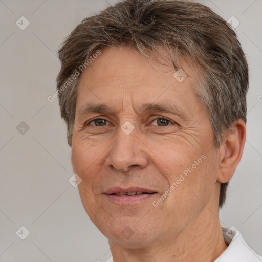 Joyful white middle-aged male with short  brown hair and brown eyes