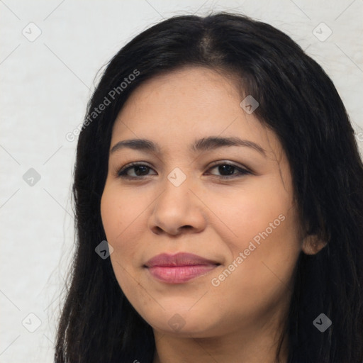 Joyful latino young-adult female with long  black hair and brown eyes