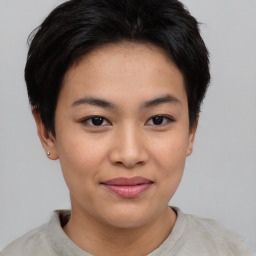 Joyful asian young-adult female with short  brown hair and brown eyes