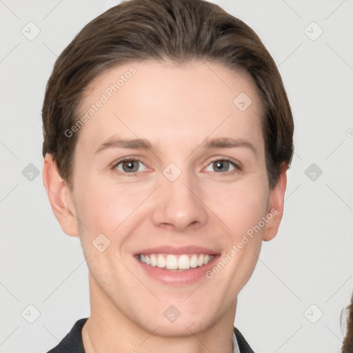 Joyful white young-adult female with short  brown hair and grey eyes