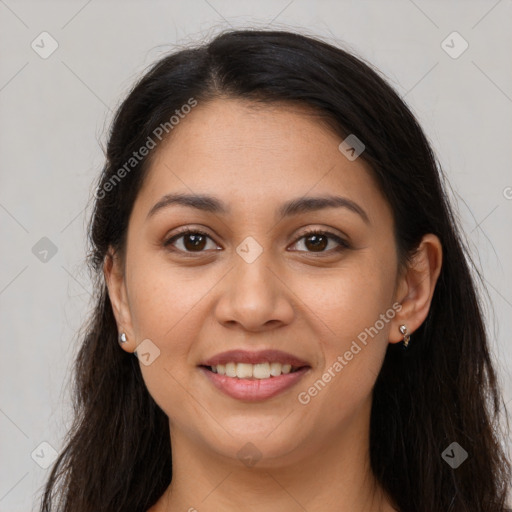 Joyful latino young-adult female with long  brown hair and brown eyes