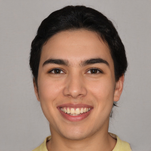 Joyful white young-adult male with short  brown hair and brown eyes