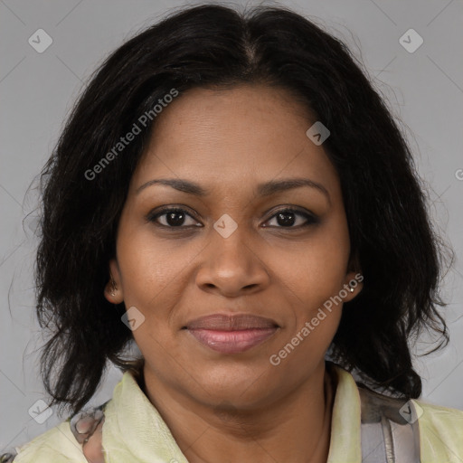 Joyful black adult female with medium  brown hair and brown eyes