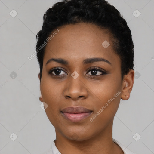 Joyful black young-adult female with short  black hair and brown eyes