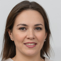 Joyful white young-adult female with medium  brown hair and brown eyes