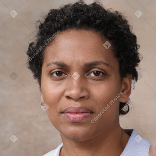 Joyful black adult female with short  brown hair and brown eyes