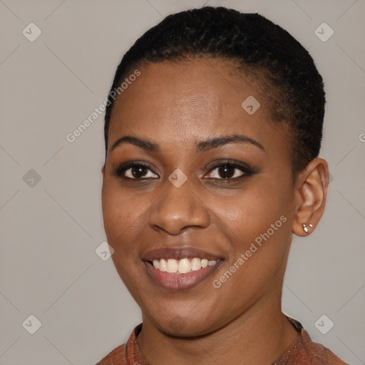 Joyful black young-adult female with short  black hair and brown eyes