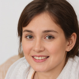 Joyful white young-adult female with medium  brown hair and brown eyes