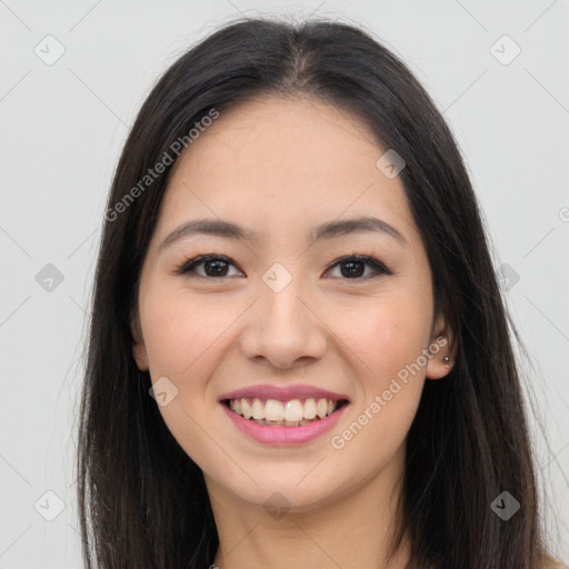 Joyful asian young-adult female with long  brown hair and brown eyes