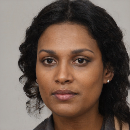Neutral black young-adult female with long  black hair and brown eyes