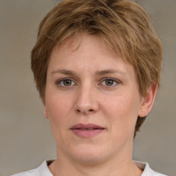 Joyful white adult female with short  brown hair and brown eyes