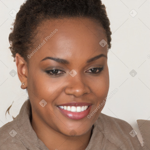 Joyful black young-adult female with short  brown hair and brown eyes