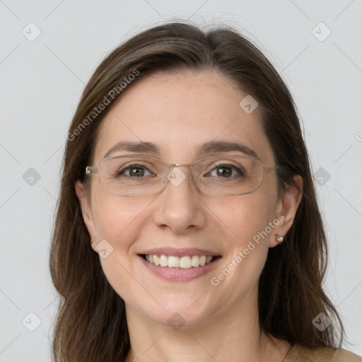 Joyful white adult female with medium  brown hair and grey eyes