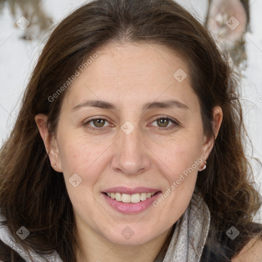 Joyful white adult female with long  brown hair and brown eyes