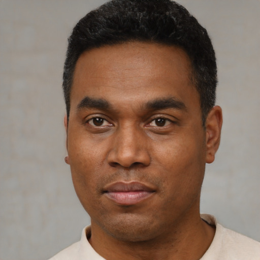 Neutral black young-adult male with short  black hair and brown eyes