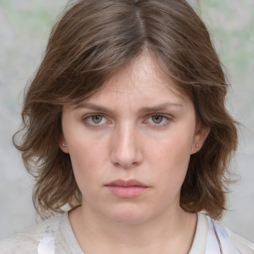 Neutral white young-adult female with medium  brown hair and grey eyes