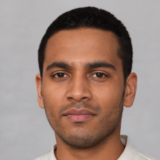 Neutral latino young-adult male with short  black hair and brown eyes