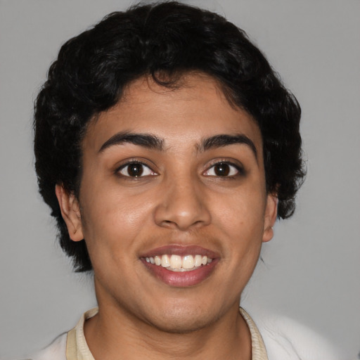 Joyful latino young-adult female with short  black hair and brown eyes