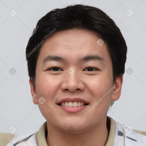 Joyful asian young-adult male with short  brown hair and brown eyes