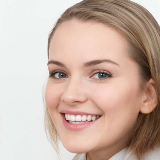 Joyful white young-adult female with long  brown hair and blue eyes