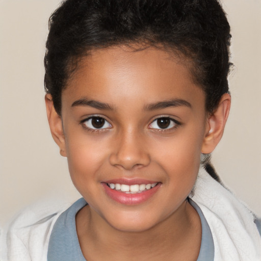 Joyful white child female with short  brown hair and brown eyes