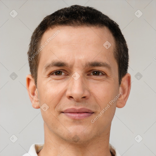 Joyful white adult male with short  brown hair and brown eyes