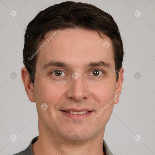 Joyful white adult male with short  brown hair and grey eyes